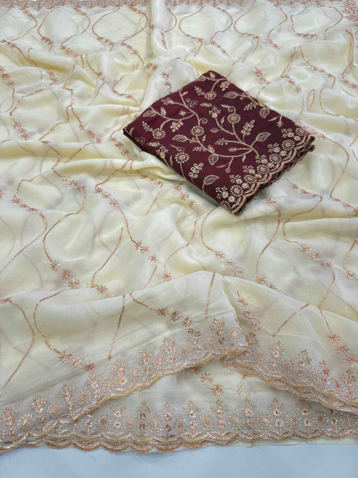 ivory charm georgette embroidered saree - yooneck