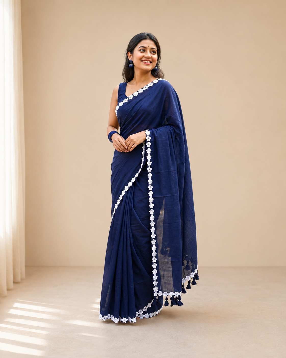 nisha blue mul cotton saree with delicate lace border