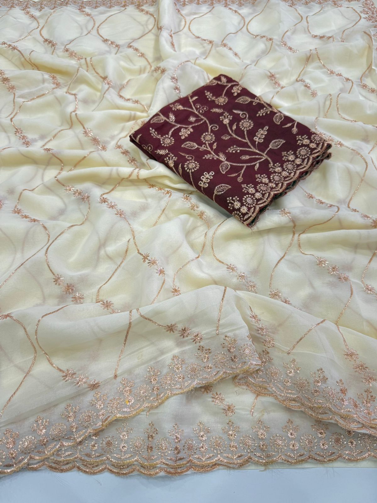 ivory charm georgette embroidered saree